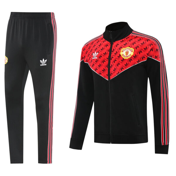 Manchester United Adidas tracksuit: black pants with red side stripes and a matching red‑black zip jacket with club crest.