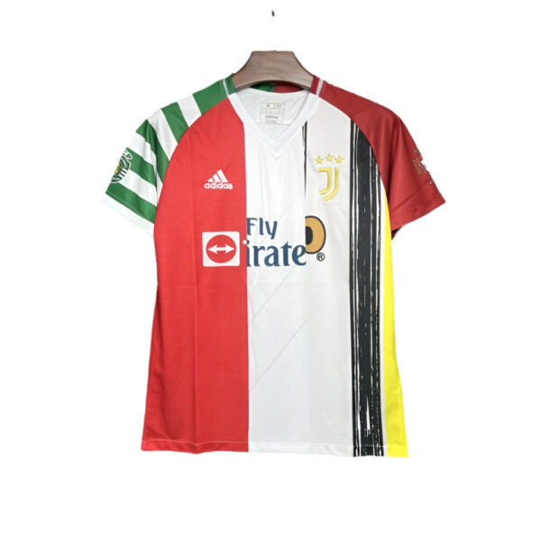 Colorful multi-panel soccer jersey with red, white, green, black and yellow panels, featuring Adidas logo and Fly Emirates sponsor.