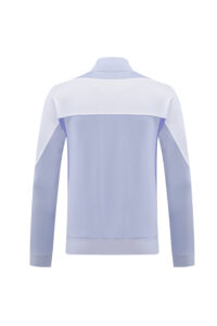 ccf5dbb9 | UAE SPORT STORE Back view of a light blue and white color-block track jacket with a white yoke and ribbed hem.