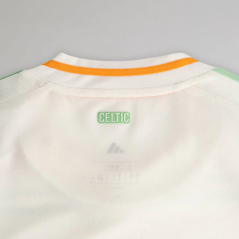 celtic-men-s-2025-26-third-shirt-1180888102 | UAE SPORT STORE Back of a white Celtic football jersey with an orange trim on the collar and a green CELTIC label.