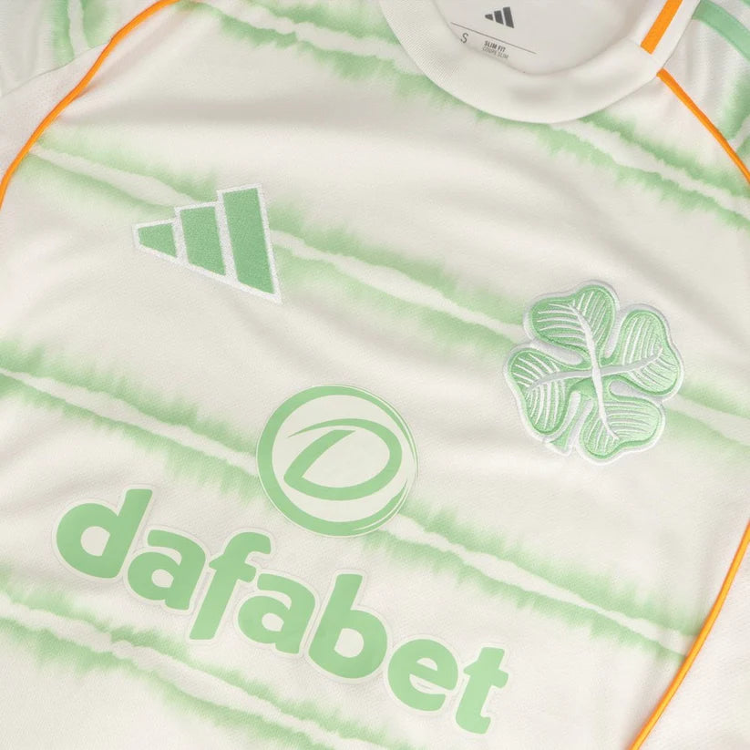 celtic-men-s-2025-26-third-shirt-1180888103 | UAE SPORT STORE Close-up of a white jersey with mint-green tie-dye pattern, displaying the Dafabet sponsor text and Adidas logo.
