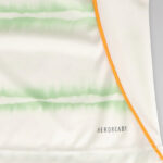 celtic-men-s-2025-26-third-shirt-1180888104 | UAE SPORT STORE Close-up of white athletic fabric with light green horizontal stripes and an orange seam, showing the AEROREADY branding.