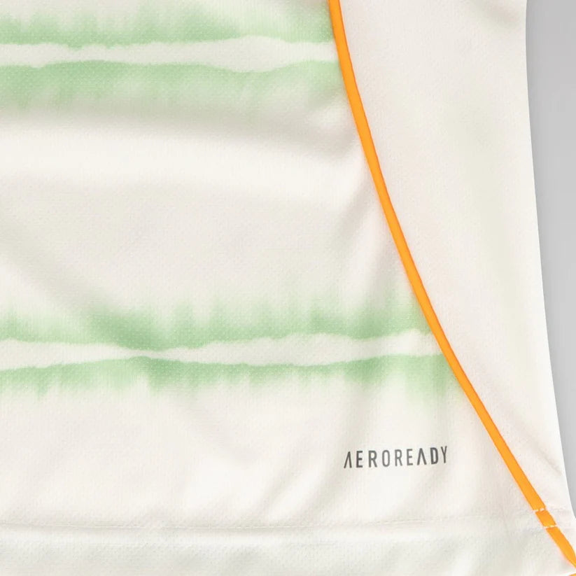 celtic-men-s-2025-26-third-shirt-1180888104 | UAE SPORT STORE Close-up of white athletic fabric with light green horizontal stripes and an orange seam, showing the AEROREADY branding.