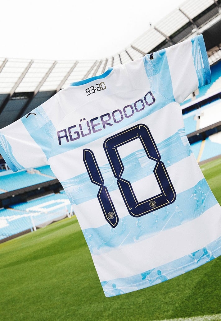city-2-min_522775d5-2ee6-4fa2-877a-1b41c136f49c | UAE SPORT STORE Soccer jersey with the number 10 hanging in a stadium, displaying the name Aguero on the back.