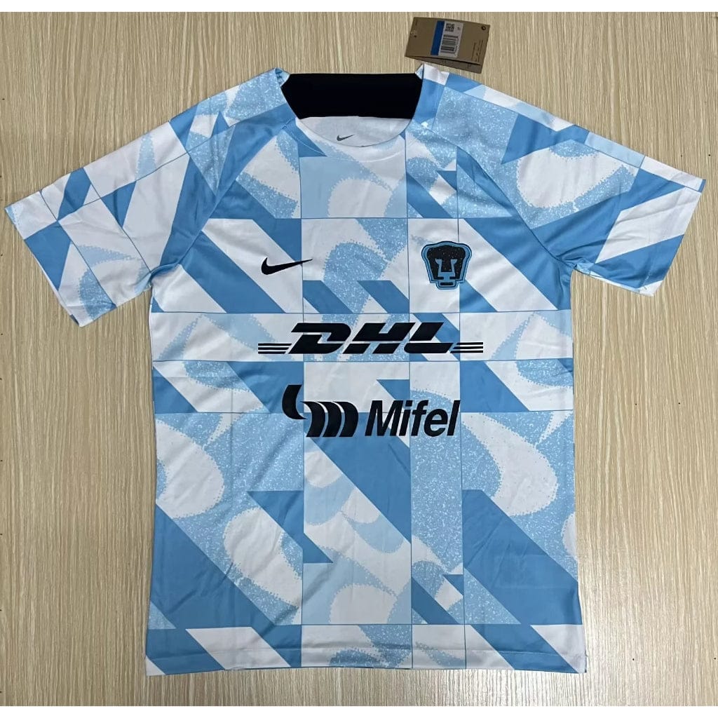 cn-11134207-7r98o-lq7wvcpuzzfc00 | UAE SPORT STORE Light blue and white geometric-patterned sports jersey with DHL and Mifel logos and a small team crest on the chest.