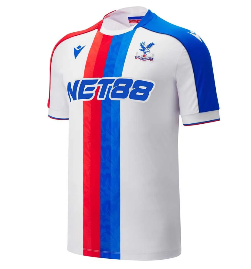 cv_74111e66-2f42-4019-9829-0aba0fe0f4ad White soccer jersey with red and blue vertical stripes and NET88 sponsor logo on the chest, blue sleeve on the right, team crest on the left chest.