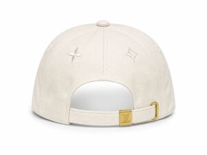 Back view of a beige Louis Vuitton cap with an adjustable strap and gold-tone buckle featuring the LV logo.