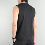Back view of a person wearing a sleeveless black gym tank top and black shorts.