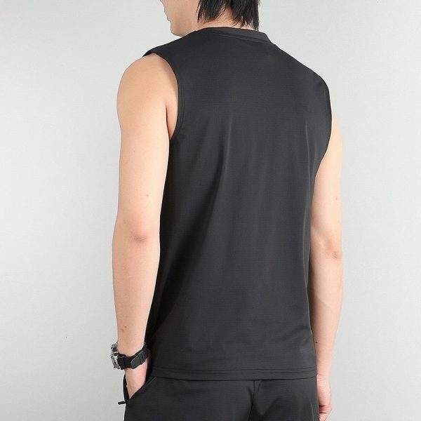 Back view of a person wearing a sleeveless black gym tank top and black shorts.