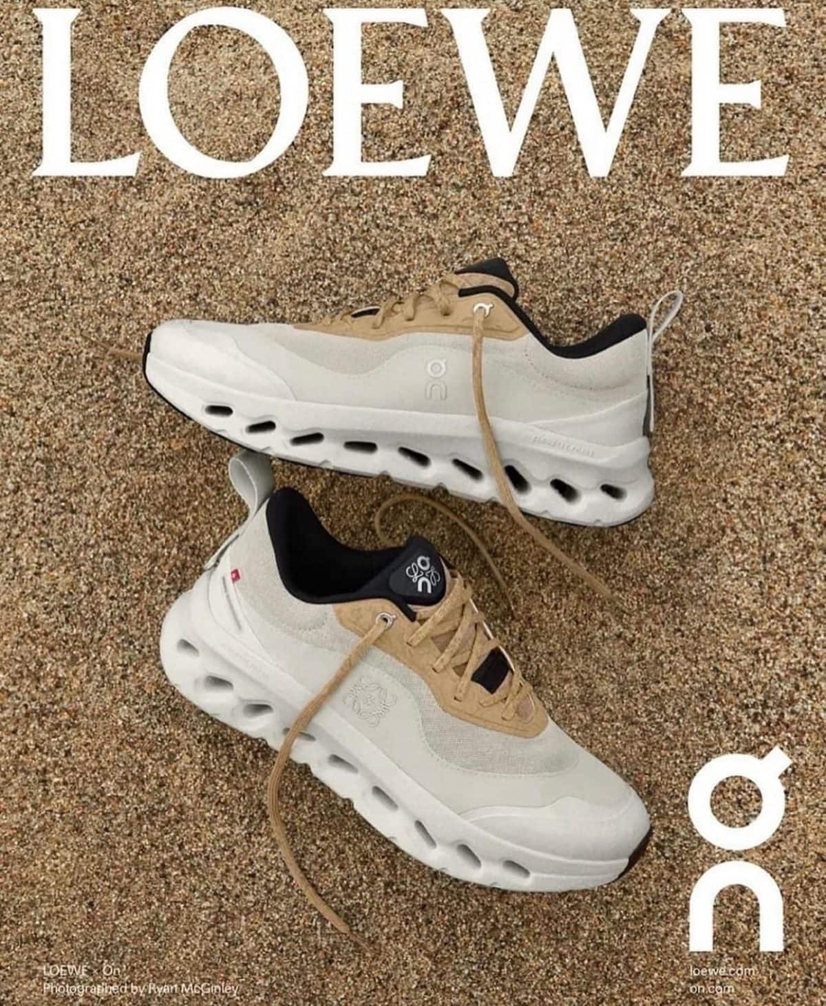 Loewe advertisement showing beige and white sneakers on a gravel surface with a large LOEWE logo above them.