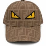 Fendi cap with bold yellow monster eyes embroidery, stylish accessory for sports and casual wear.