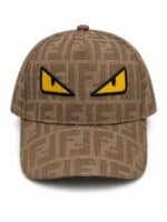 Fendi cap with bold yellow monster eyes embroidery, stylish accessory for sports and casual wear.
