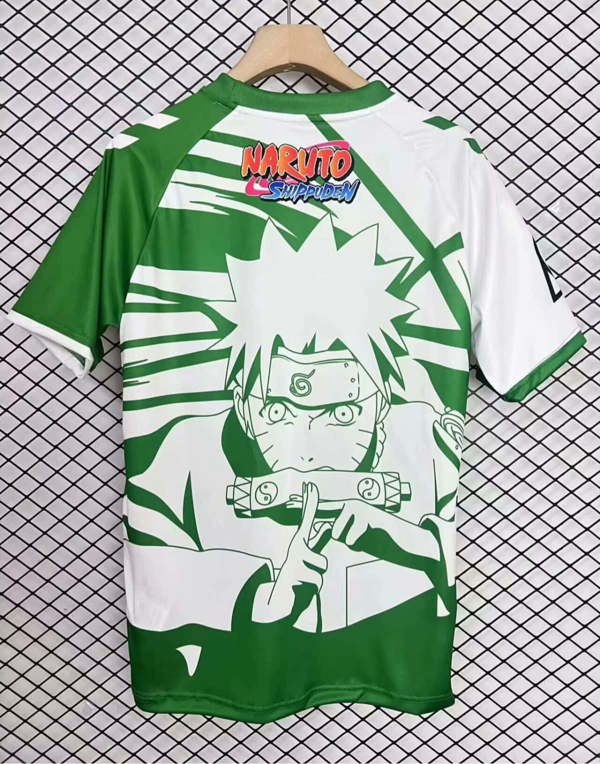 Back view of a green and white Naruto Shippuden T-shirt with a large Naruto graphic and logo on the back edge of the collar.