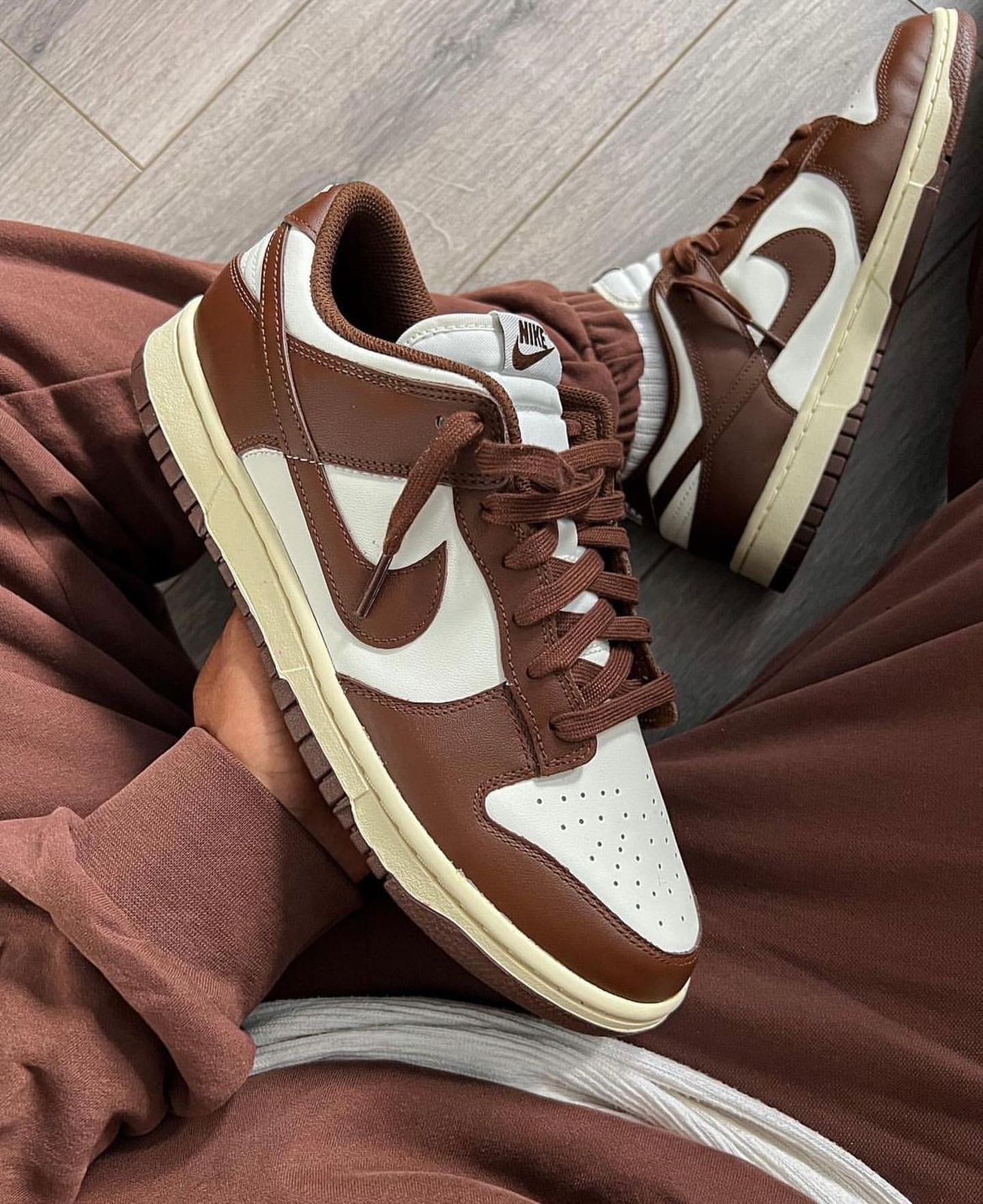 d4508b16-afeb-493b-992e-e27aaf229dbd | UAE SPORT STORE Brown and white Nike sneakers with cream soles, shown from a tilted side view.
