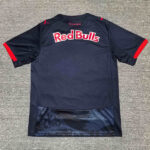 Back view of a navy Red Bulls training jersey with red sleeve cuffs and the Red Bulls logo across the upper back