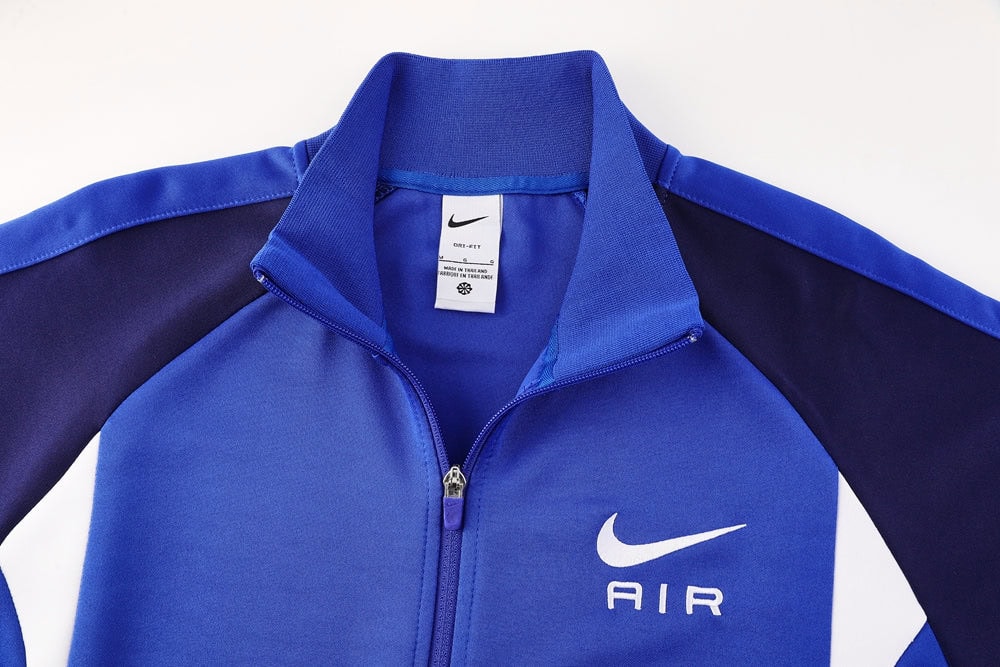 d5be3ef9 | UAE SPORT STORE Blue Nike zip-up jacket with white swoosh and AIR logo on the left chest area of the garment.