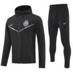 Black hooded zip-track jacket with Inter Milan crest and Nike logo, paired with matching black pants and a diagonal reflective stripe across the chest area.