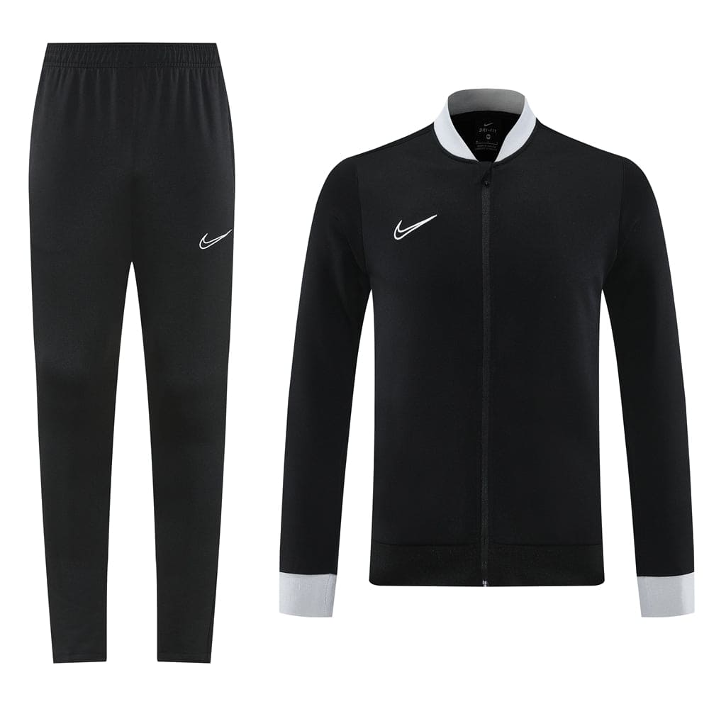 d64956ce | UAE SPORT STORE Black Nike tracksuit set: full-zip jacket with grey cuffs and collar, paired with black jogger pants showing a white Nike swoosh.
