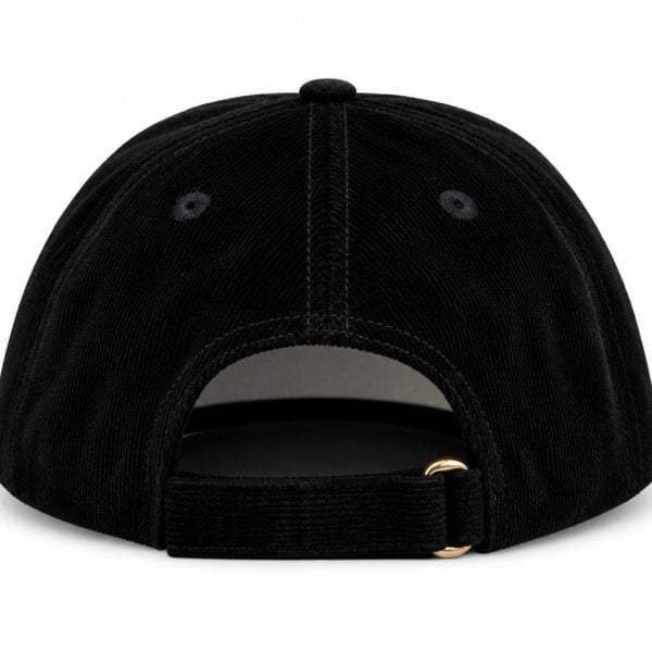 Back view of a black corduroy baseball cap with an adjustable strap and brass buckle detail.