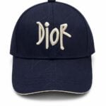 Navy baseball cap with white Dior embroidery on the front.