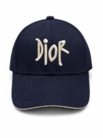 Navy baseball cap with beige Dior logo stitched on the front
