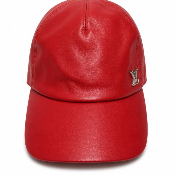 Red leather baseball cap with stitched panels and a small LV logo badge on the side.