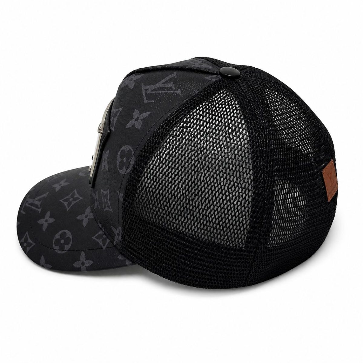 Black trucker cap with a dark Louis Vuitton monogram print on the front and black mesh back panels, with a metal button on top.