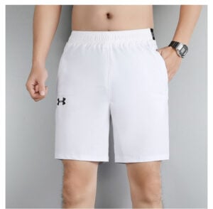 d8d21745 | UAE SPORT STORE White athletic shorts with a black Under Armour logo on the left leg, elastic waistband, shown on a male model with a watch.
