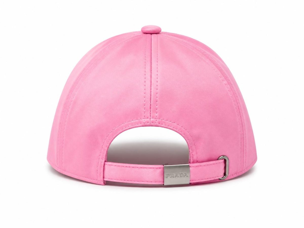 Pink baseball cap viewed from the back with an adjustable strap and metal Prada clasp