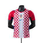 Croatian national soccer jersey with red-and-white checkerboard pattern and crest on the chest, on a mannequin.