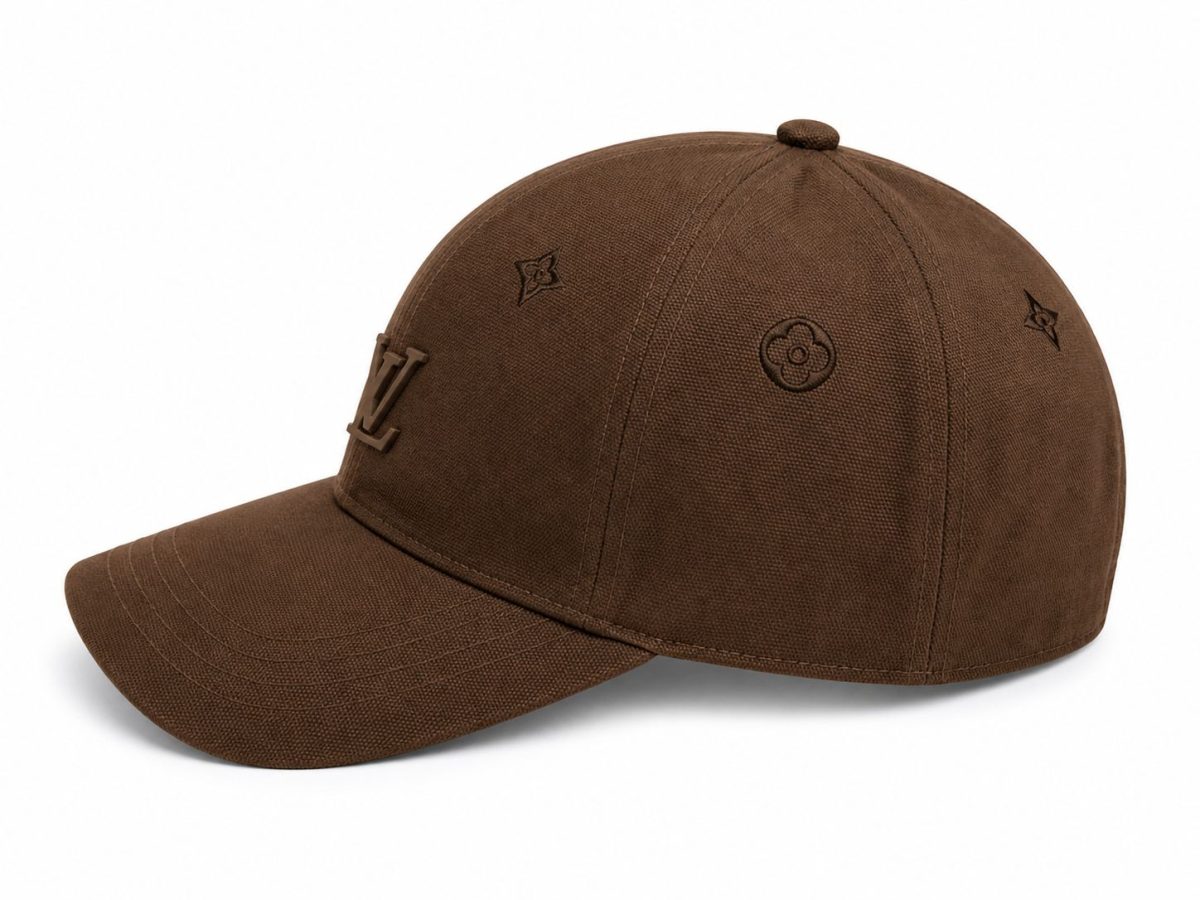 Brown baseball cap in a warm brown fabric with an LV emblem on the front and small LV floral motifs on the sides.