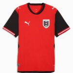 Red soccer jersey with black short sleeves and white Puma logos on the chest and sleeves, left chest crest with shield design.
