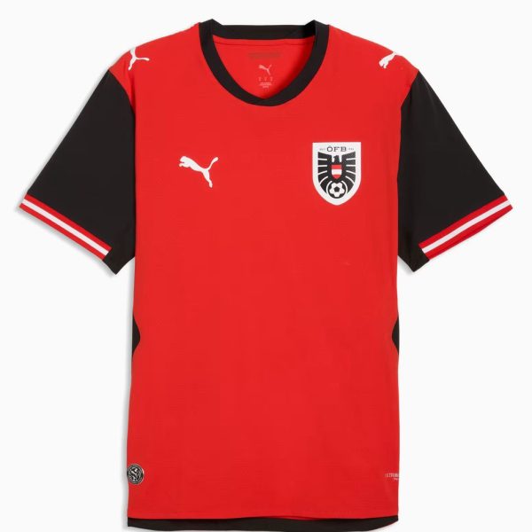 Red soccer jersey with black short sleeves and white Puma logos on the chest and sleeves, left chest crest with shield design.