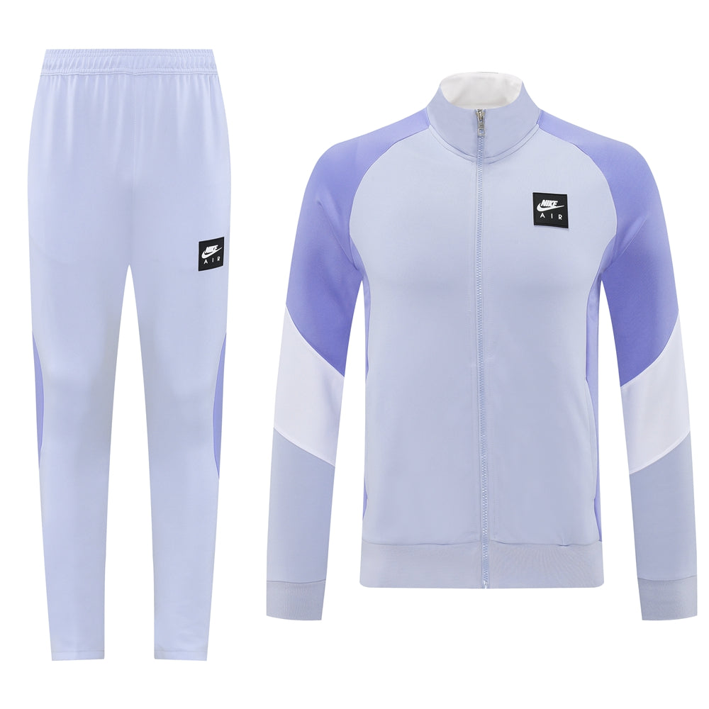 dc6b0fc5 | UAE SPORT STORE Light purple Nike Air tracksuit jacket with color-block panels and matching lavender pants, logo on chest/pants.