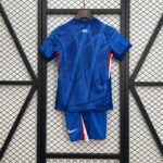Blue sports jersey on a hanger seen from the back, with a small 'CFC' label and a Nike swoosh visible on the shorts below.