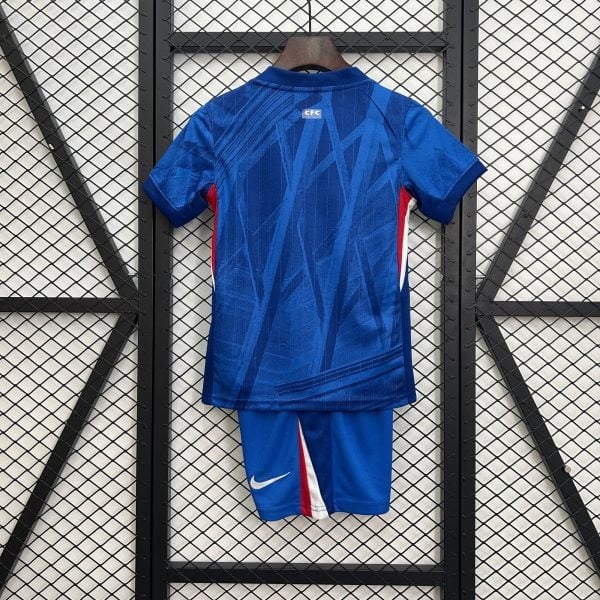Blue sports jersey on a hanger seen from the back, with a small 'CFC' label and a Nike swoosh visible on the shorts below.