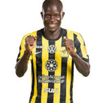Male soccer player in yellow and black striped jersey giving thumbs up.