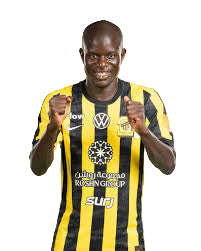 Male soccer player in yellow and black striped jersey giving thumbs up.