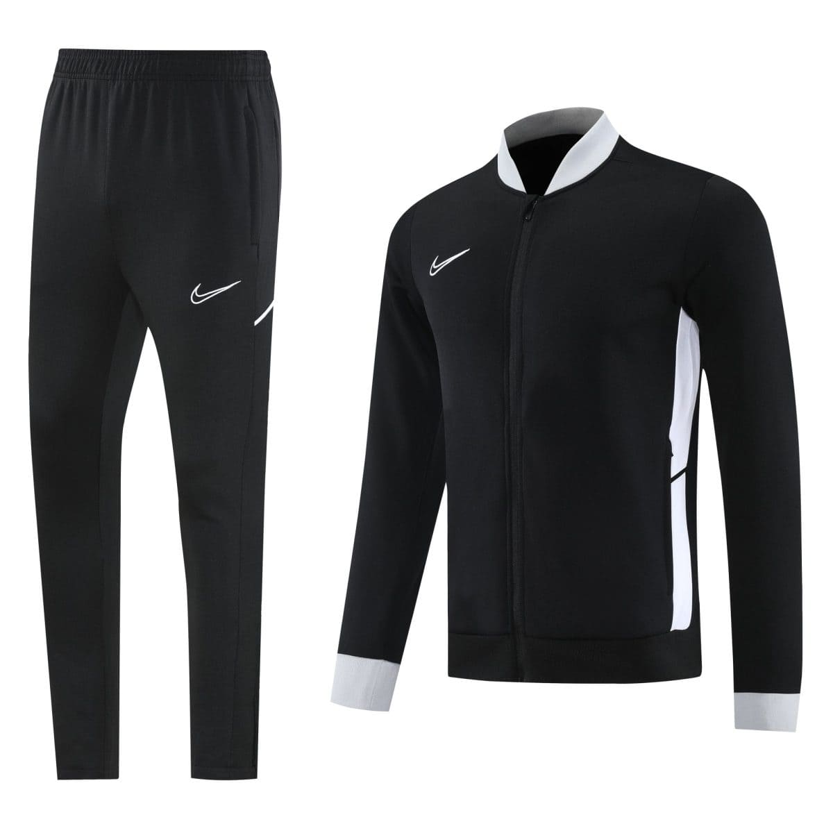 Black athletic tracksuit set (zip-up jacket and jogger pants) with white Nike swoosh logos on chest and thigh, and white side panels on the jacket and pant cuffs, displayed against a white background.