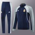 dda43392 | UAE SPORT STORE Real Madrid Adidas training tracksuit: navy blue with light gray sleeves, white stripes, jacket and pants set.