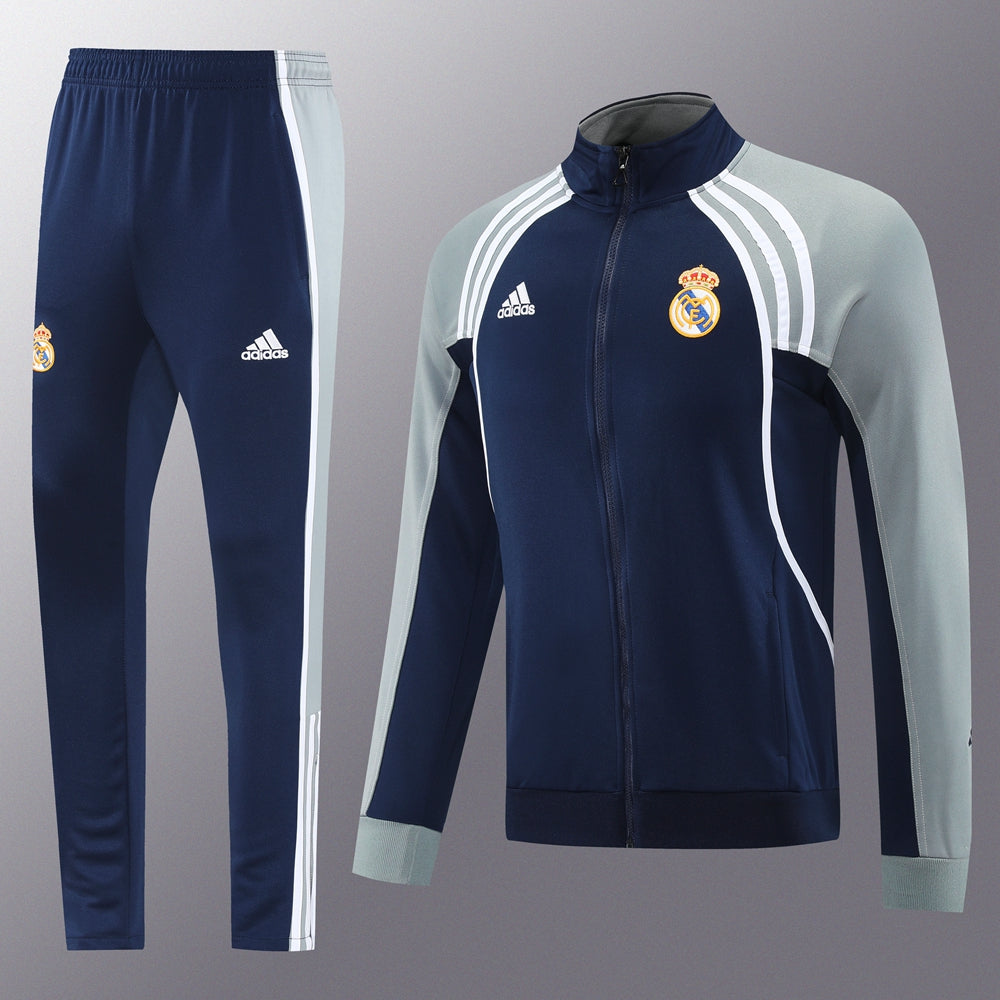 dda43392 | UAE SPORT STORE Real Madrid Adidas training tracksuit: navy blue with light gray sleeves, white stripes, jacket and pants set.