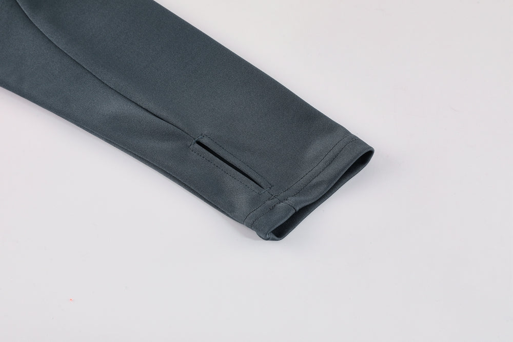 deadf90e | UAE SPORT STORE Close-up of a gray sleeve cuff with a small zippered vent.