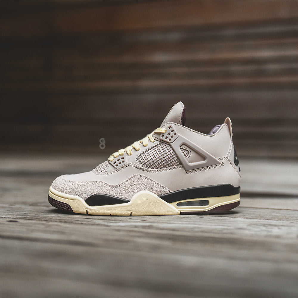 dsc06600b Beige athletic sneaker with cream sole on a wooden surface, side view.