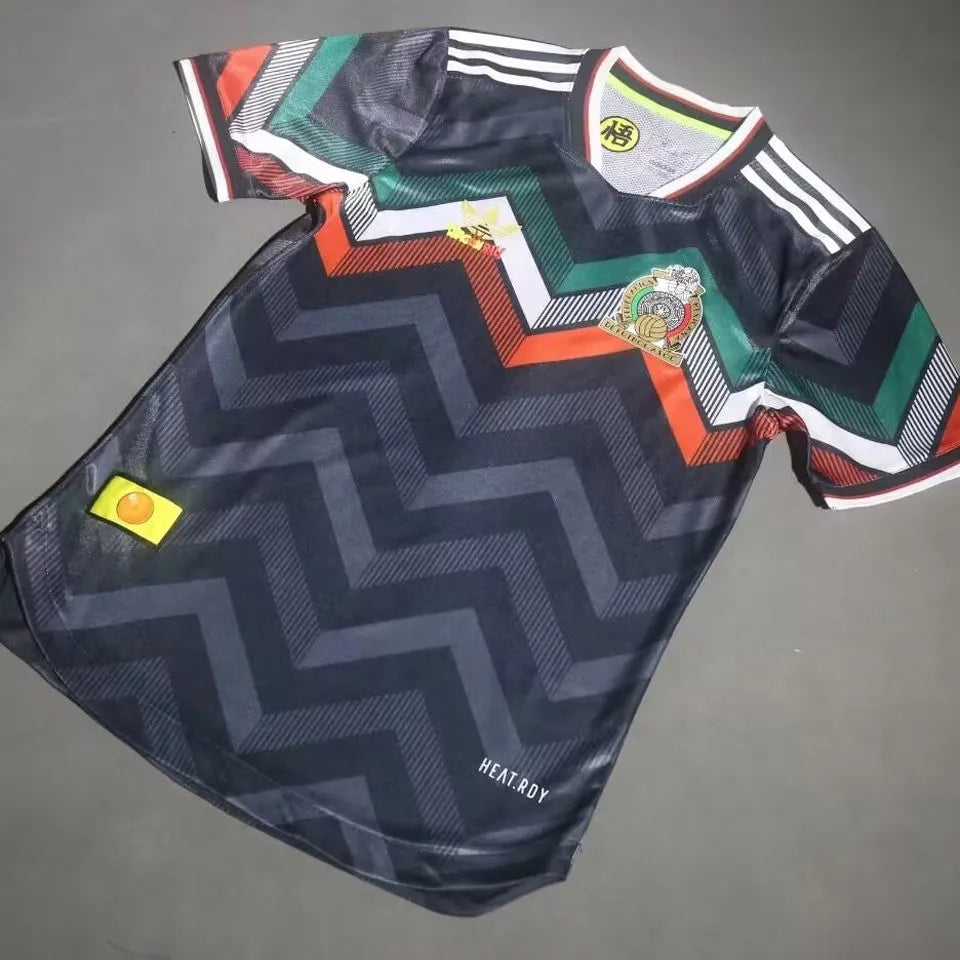e121e06ee85d5cfb | UAE SPORT STORE Dark blue zigzag-patterned soccer jersey with multicolor chevron stripes, white Adidas stripes on sleeves, crest on the chest, and HEAT.RDY near the hem.