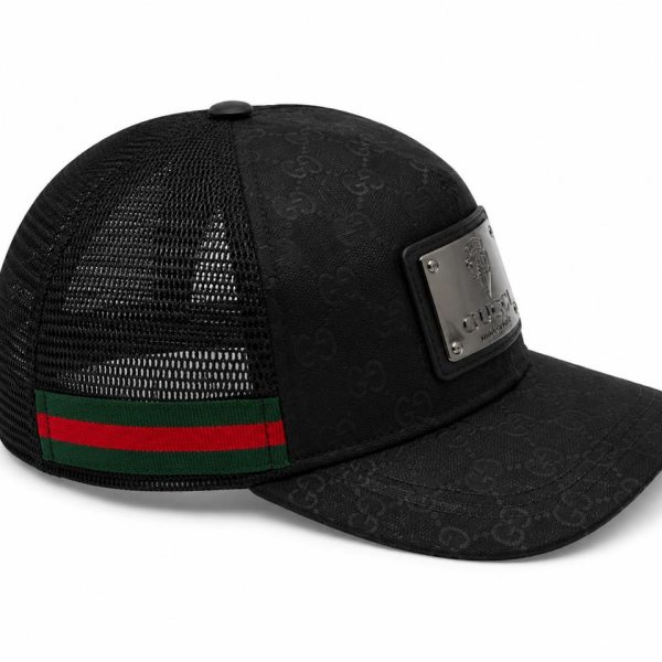 Black Gucci trucker cap with mesh back and red-green strap; metal logo plate on front front panel.