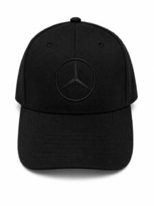 Black baseball cap with Mercedes‑Benz three‑pointed star logo centered on the front panel (emblem inside a circle).