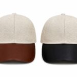 Pair of beige textured caps with contrasting brims—brown on the left, black on the right.
