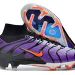Purple and black Nike soccer cleat with an orange swoosh and a blue Zoom Air sole plate showing through the top panel.