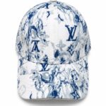 Blue-and-white floral Louis Vuitton cap with LV monogram pattern on a white background, front view.