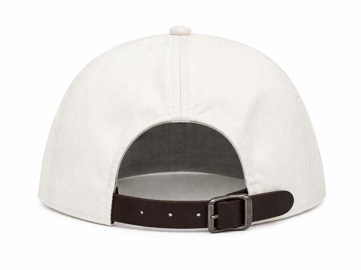 White baseball cap viewed from the back, showing an adjustable brown leather strap with a metal buckle.